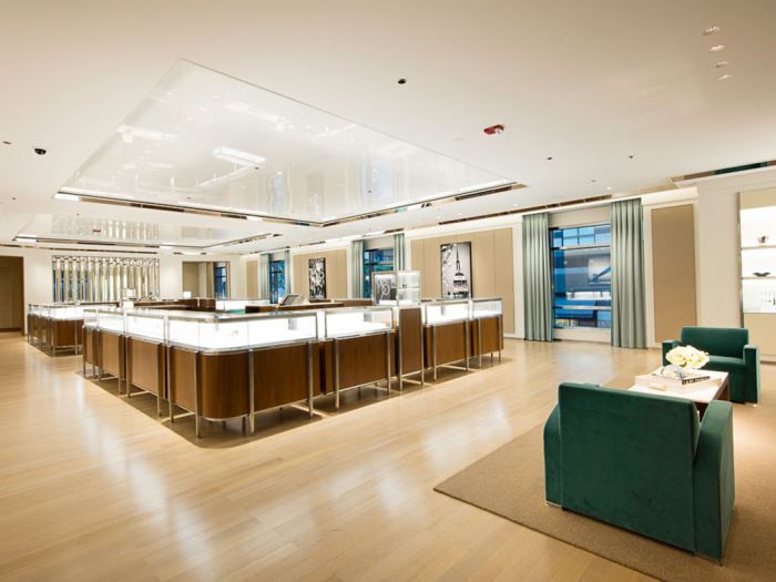 A large room with a giant rectangular display case inside a Tiffany & Co. store