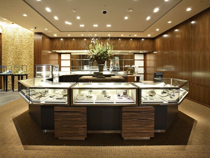 A closer look at a large pentagonal display case inside a Tiffany & Co. store